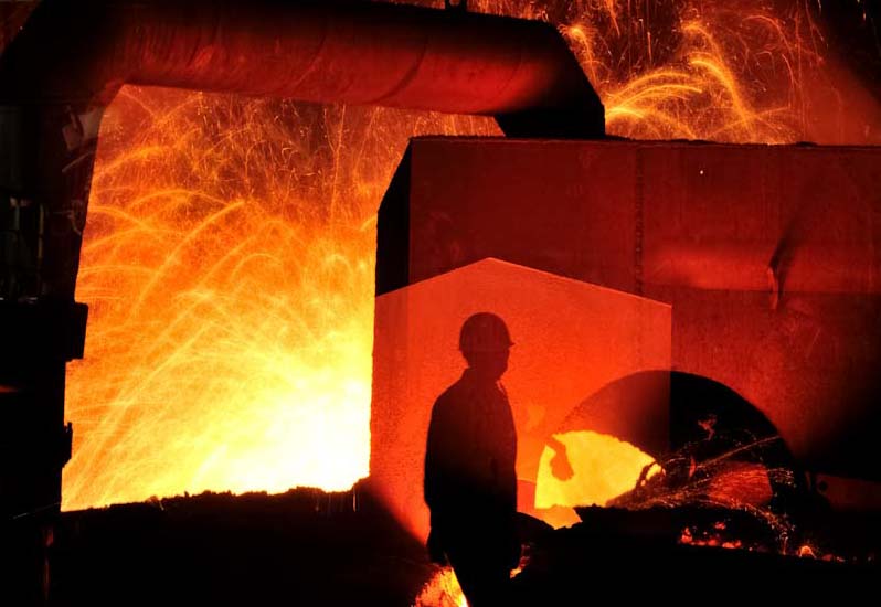 Electric Arc Furnace and steel worker